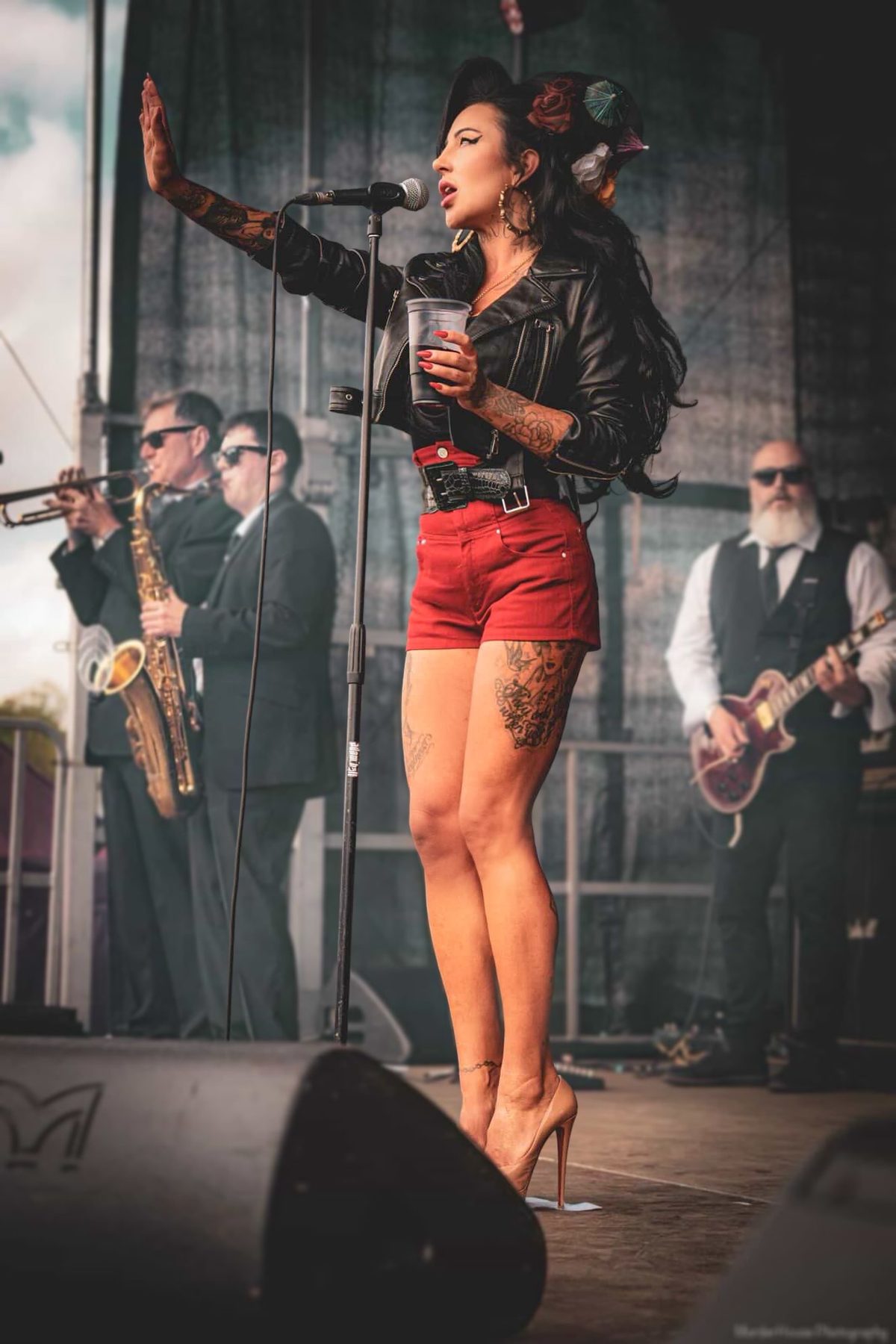 Nadine L’Amour performing centre stage with the live band